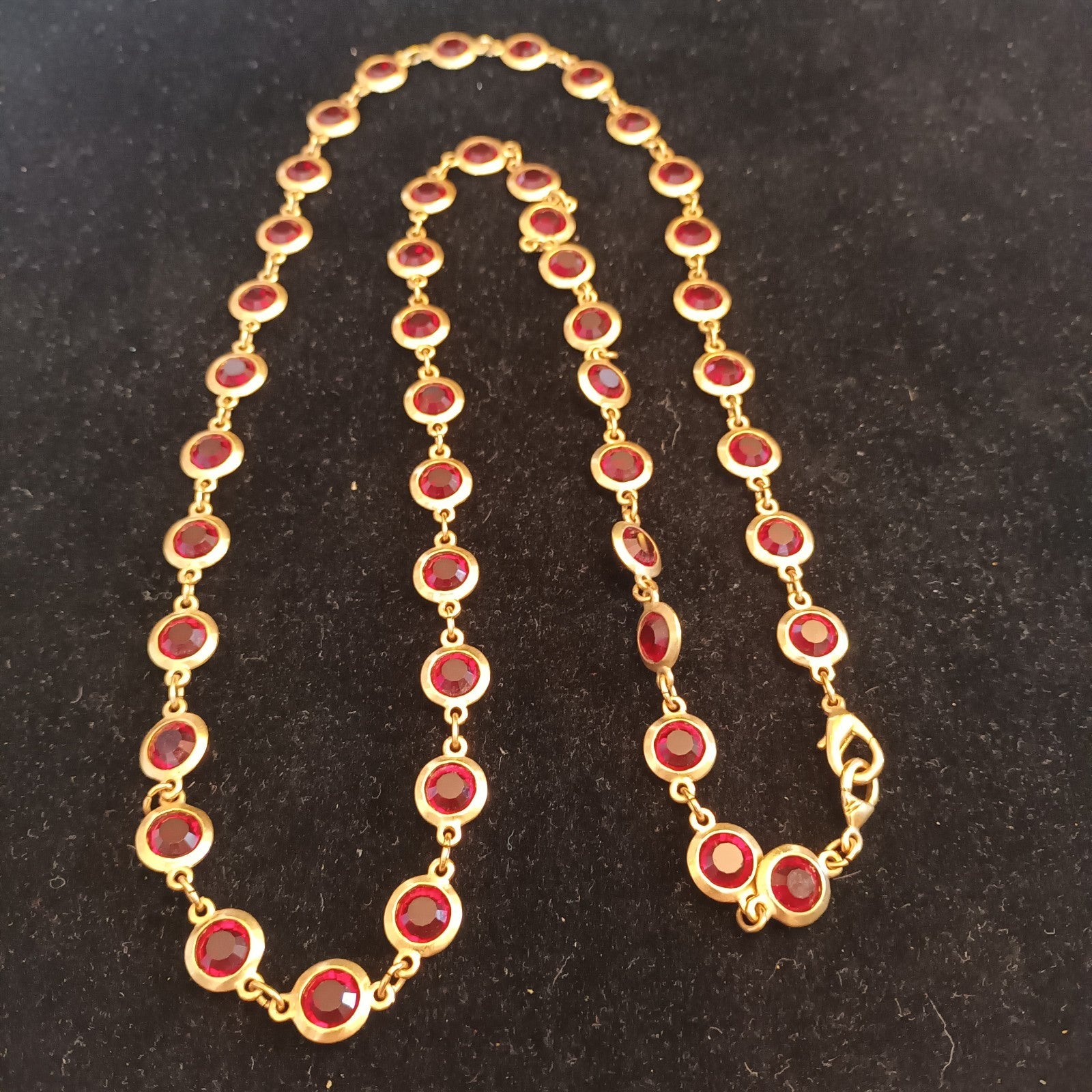 Gold tone bezel set necklace red stones 88cm long