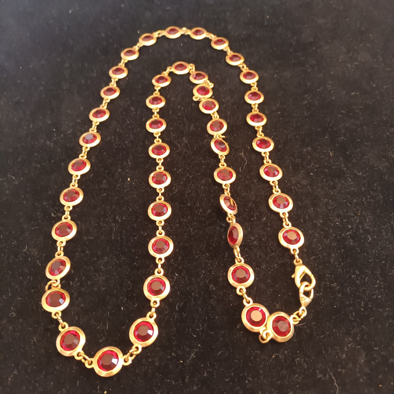Gold tone bezel set necklace red stones 88cm long