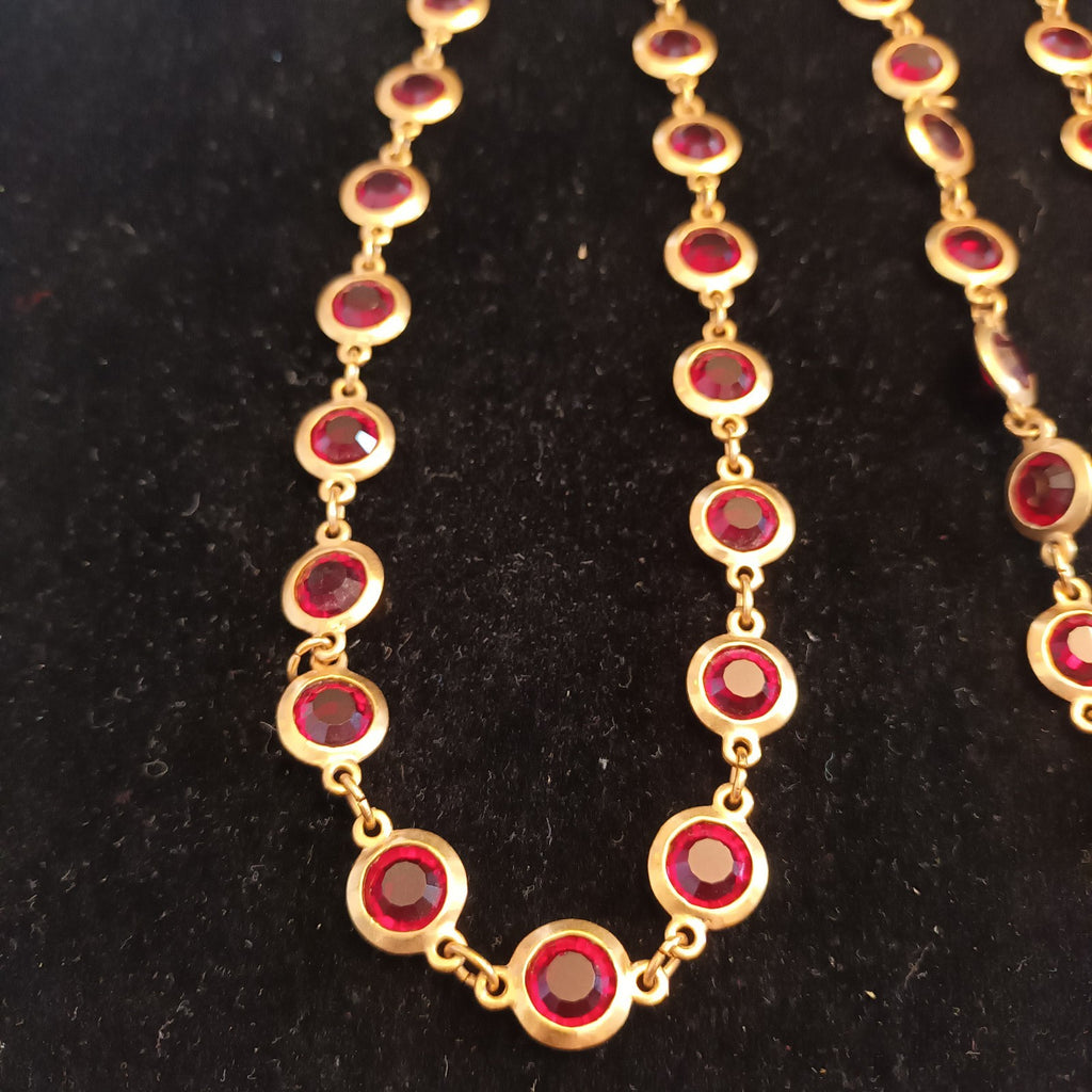 Gold tone bezel set necklace red stones 88cm long