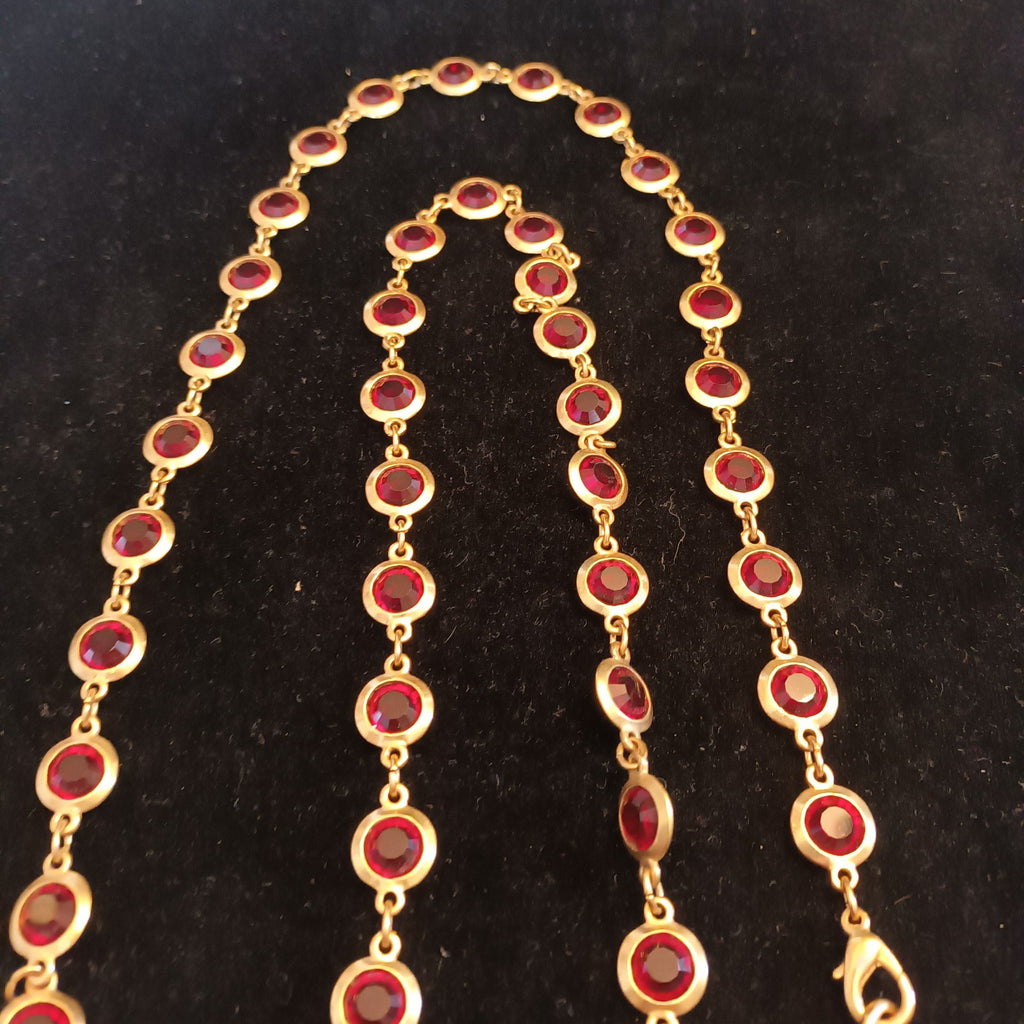 Gold tone bezel set necklace red stones 88cm long